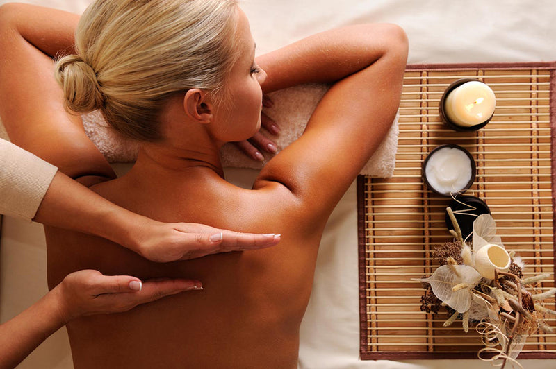 a woman enjoying her weekly deep tissue massage