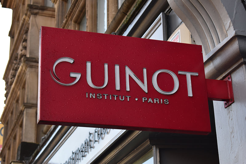 guniot sign outside the treatment rooms salon