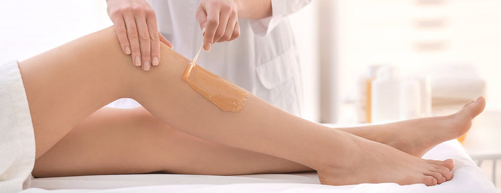 waxing leg to remove hair and leave smooth beauty treatment